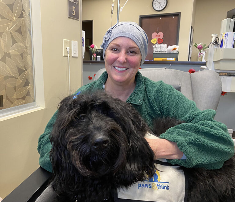 Healing comfort: Ascension St. Vincent in Fishers kicks off pet therapy program with Paws & Think Jenni Pettigrew, who is going through treatment for breast cancer, gets a visit from Lulu the therapy dog at Ascension St. Vincent Hospital in Fishers. (Photo by Leila Kheiry)